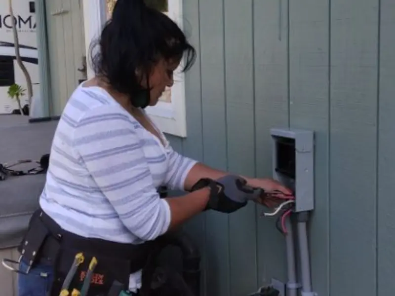 Licensed electrician wiring an exterior subpanel in Prospect